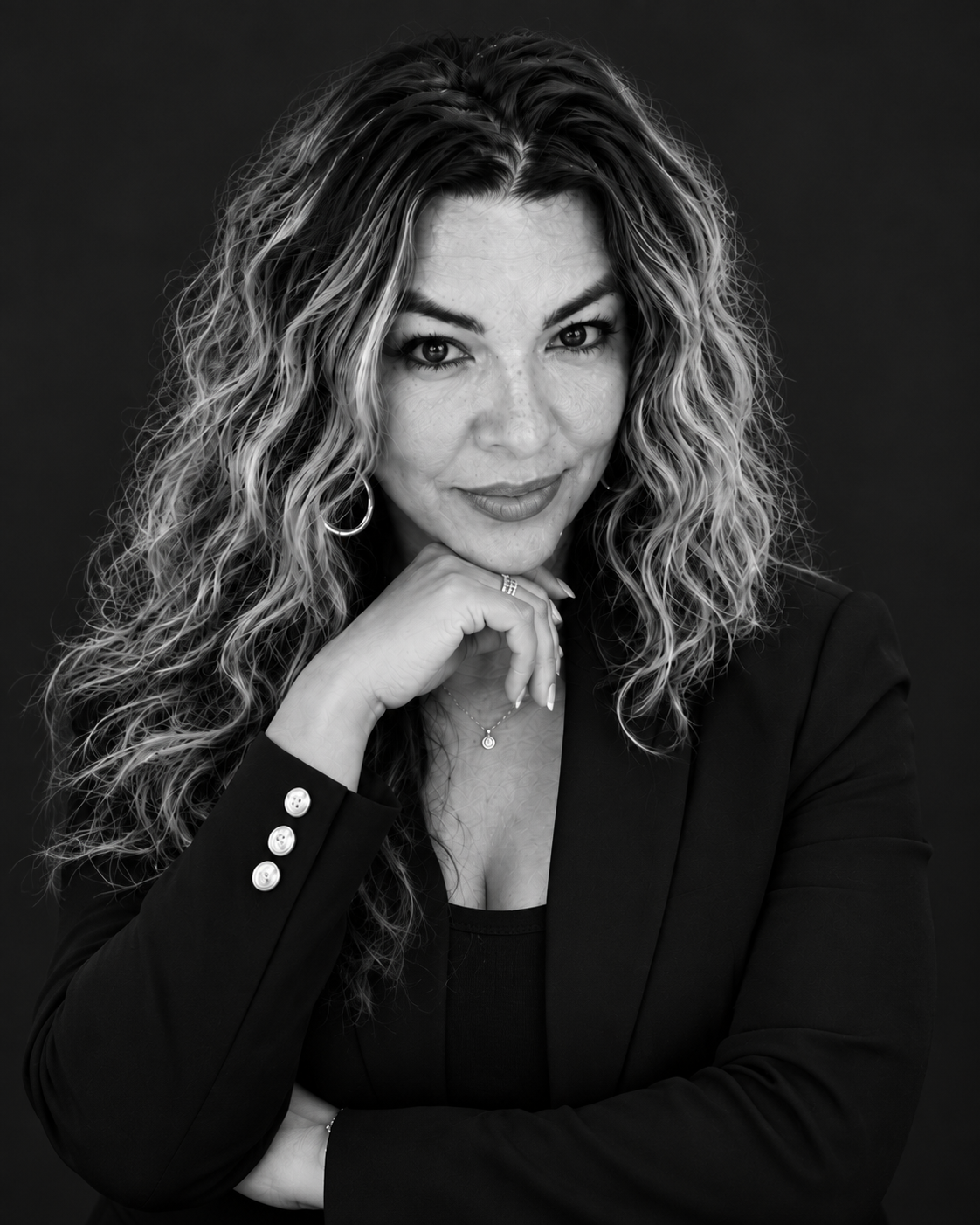 Felisha M. Jacques in a black blazer, black-and-white founder portrait